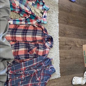 A bundle of different flannels